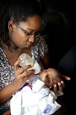 Infant Drinking From Baby Bottle