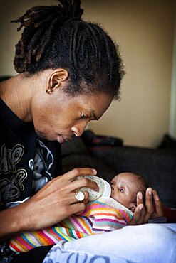 Infant Drinking From Baby Bottle