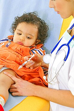 Pediatrician Vaccinating A Child