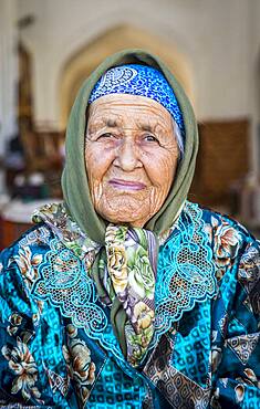 Umarova Saida, sunflower seeds vendor, in Taki-Telpak Furushon bazaar, Bukhara, Uzbekistan