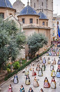 Flower offering parade,People with Floral tributes to `Virgen de los desamparados��, Fallas festival,carrer del Micalet street,Valencia