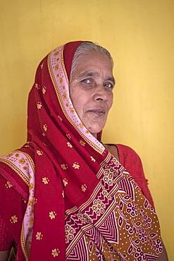 Mrs Parvathy (widow), in Ma Dham ashram for Widows of the NGO Guild for Service,the NGO proposes widows to wear colorful clothes, Vrindavan, Mathura district, India