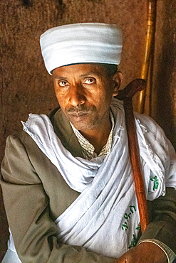 Portrait of a man inside the rock hewn monolithic church of Bet Giyorgis (Church of St. George) in Lalibela, Ethiopia