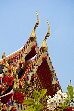 Tiered roof with cho fa finials on a viharn at Wat Pho Buddhist Temple, Bangkok, Thailand.