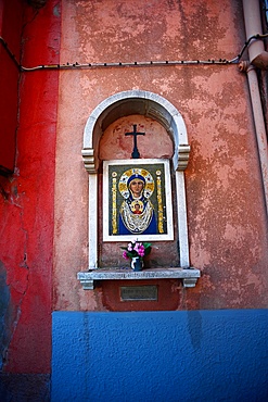 Catholic altar in the wall of a house at Murano, Venice, Italy