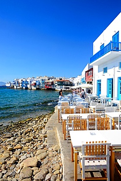 Cafe terrace with Little Venice in view, Mykonos, Greece