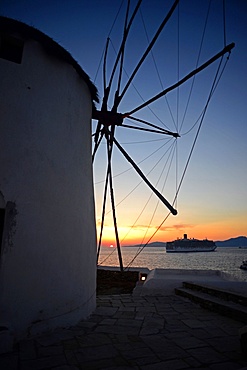 Traditional windmills (Kato Milli) at sunset in Mykonos town, Greece