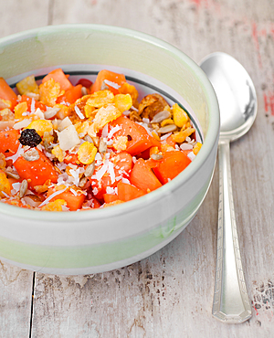 fruit salad with papaya, granola and Brazil Nut