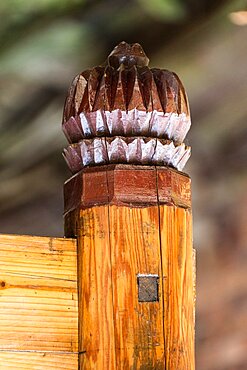 A hand-carved finial on a piece of furniture in the Red Yao village of Huangluo, China.