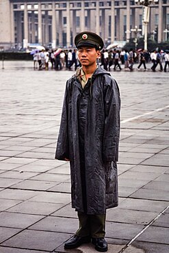 A soldier stands guard in Tiananmen Square on a rainy day in Beijing, China.