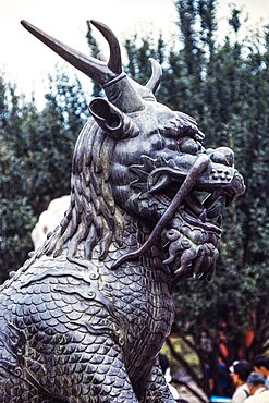 A bronze statue of the mythical qilin or unicorn in Chinese folklore. Summer Palace, Beijing, China.