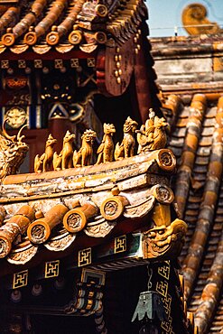 Ceramic figurines on the ridge of the roof of the Lama Temple, a Tibetan Buddhist temple in Beijing, China.