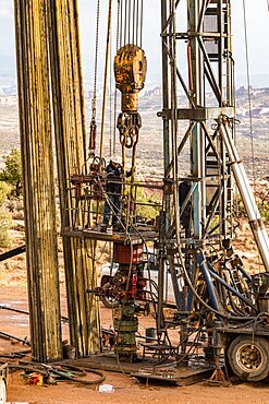 The well service crew on a workover rig works on an oil well to try to bring it back into service.