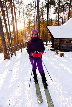 Young woman practicing Altai Skiing in Pyha ski resort, Lapland, Finland