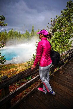 Young woman in Norris Geyser Basin, Yellowstone National Park, USA