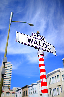 Waldo street sign painted with red stripes in San Francisco, California,