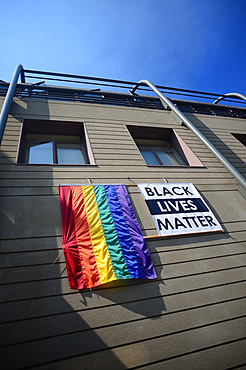 "Black lives matter" sign and gay flag on building, San Francisco, California,