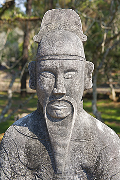 A stone statue of a man at the tomb of Emperor Tu Duc, near Hue, Vietnam