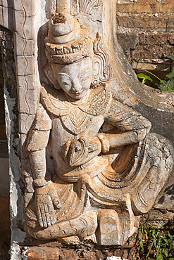 A carved Buddha statue on a stupa at the Shwe Indein Pagoda, Indein, Shan State, Myanmar, (Burma)