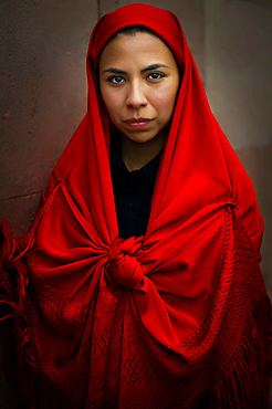 Women wearing traditional Potosi rebozos and carrying candles,