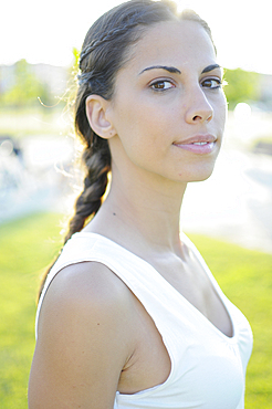 Portait of attractive young spanish woman in nature