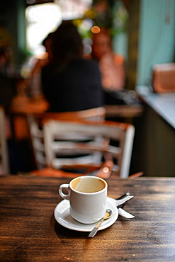 Empty coffee mug on table in a cafe