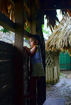 Portrait of a Bribri young girl (Adriana) inside a cottage, A day with the Bribri, indigenous people in Lim?n Province of Costa Rica