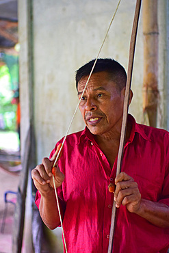 Catato L?pez, Bribri man holding handmade bow, A day with the Bribri, indigenous people in Lim?n Province of Costa Rica