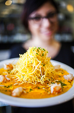 waitress shows Carpaccio of eggs and shrimp with crispy potato, Bar Mut, Pau Claris 192, Barcelona, Spain