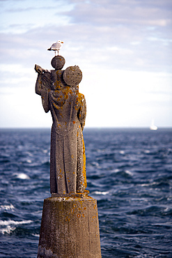 Statue on the sea, Kerpenhir point, town of Locmariaquer, departament of Morbihan, Brittany, France