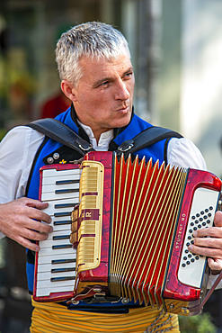 Traditional music of Galicia. Gaiteiros Rio de anxo. Old Town, Santiago de Compostela, UNESCO World Heritage Site, Galicia, Spain.

Bagpipes are a woodwind instrument using enclosed reeds fed from a constant reservoir of air in the form of a bag. The Scottish Great Highland bagpipes are the best known examples in the Anglophone world, but people have played bagpipes for centuries throughout large parts of Europe. The term bagpipe is equally correct in the singular or the plural, though pipers usually refer to the bagpipes as the pipes, a set of pipes or a stand of pipes.