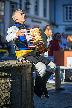 Traditional music of Galicia. Gaiteiros Rio de anxo. Old Town, Santiago de Compostela, UNESCO World Heritage Site, Galicia, Spain.

Bagpipes are a woodwind instrument using enclosed reeds fed from a constant reservoir of air in the form of a bag. The Scottish Great Highland bagpipes are the best known examples in the Anglophone world, but people have played bagpipes for centuries throughout large parts of Europe. The term bagpipe is equally correct in the singular or the plural, though pipers usually refer to the bagpipes as the pipes, a set of pipes or a stand of pipes.