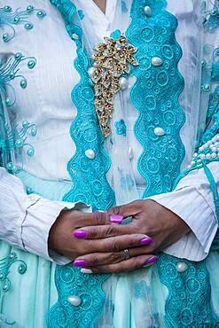 Benita la Intocable, detail of her dress and hands, cholita female wrestler, El Alto, La Paz, Bolivia