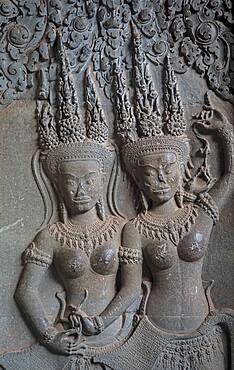 Aspara sculptures in bas-relief on the wall, in Angkor Wat, Siem Reap, Cambodia