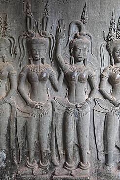 Aspara sculptures in bas-relief on the wall, in Angkor Wat, Siem Reap, Cambodia