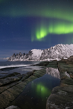 The Aurora Borealis (Northern Lights) over The Devils Jaw (Devils Teeth), Oskornan mountains, Tungeneset, Senja, Troms og Finnmark County, Norway, Scandinavia, Europe