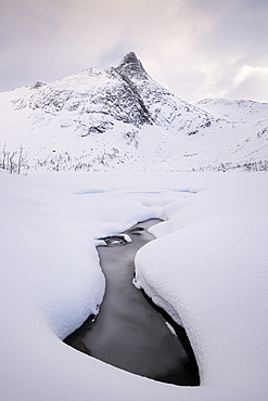 Looking to Krokelvvatnet Frozen Lake and Krokelvtindan mountain in full winter conditions, Senja, Troms og Finnmark County, Norway, Scandinavia, Europe