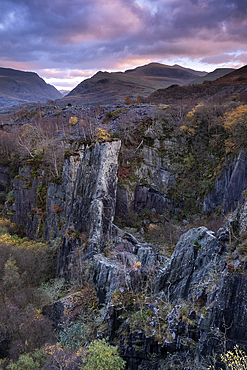 Glyn Rhonwy Disused Slate Quarry backed by the Llanberis Pass and Yr Wyddfa or Mount Snowdon in autumn, near Llanberis, Eryri or Snowdonia National Park, North Wales, UK