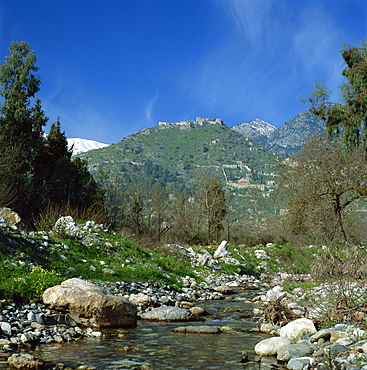 Landscape with river and church and fortress on a hill in the background at Mistras, Greece, Europe