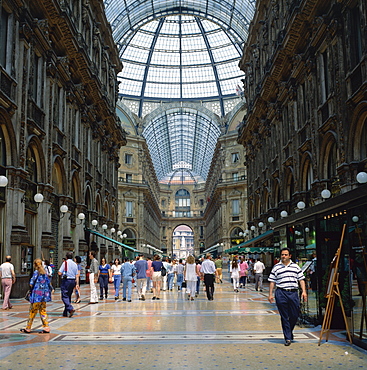 Shoppers in the Galleria Vittoria Emanuele, the world's oldest shopping mall, in the city of Milan, Lombardy, Italy, Europe