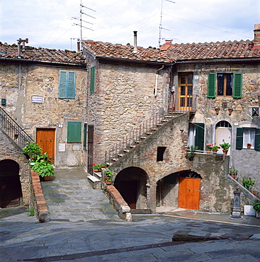 Old houses on a street in the village of Monteciano in Tuscany, Italy, Europe