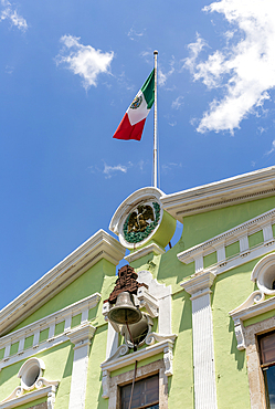 Mexican flag flying, Governor's Palace government building (Palacio de Gobierno), Merida, Yucatan State, Mexico, North America