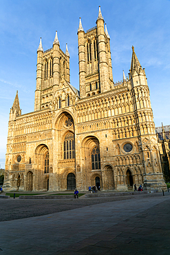 West frontage of cathedral church in evening light, Lincoln, Lincolnshire, England, UK