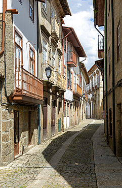 Street of historic buildings with balconies, Rua João Lopes de Faria, city centre Guimaraes, northern Portugal, Europe