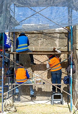 Workers maintaining stonework Eagles and Jaguars platform, Mayan ruins, Chichen Itza, UNESCO World Heritage Site, Yucatan, Mexico, North America