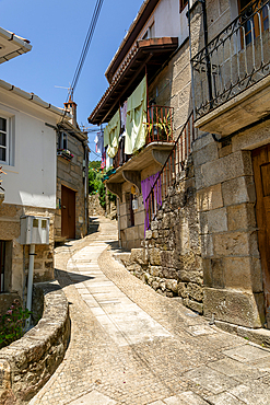 Narrow street of historic houses in village of Pazos de Arenteiro, Boborás, Ourense province, Galicia, Spain, Europe