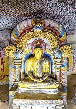 Buddha figure inside Dambulla cave Buddhist temple complex, UNESCO World Heritage Site, Sri Lanka, Asia