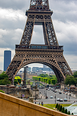 Eiffel Tower on a cloudy day, iconic Parisian landmark with surrounding streets and greenery, Paris, France, Europe