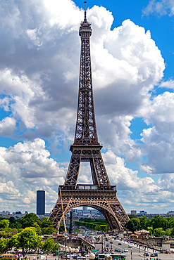 Eiffel Tower on a sunny day with blue sky and fluffy clouds, iconic Parisian landmark, Paris, France, Europe