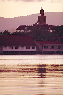 Big Buddha at Koh Faan with Laem Maikaen Cape (hills) in background, Koh Samui (Ko Samui) island, Thailand